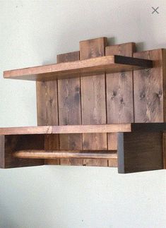 two wooden shelves are hanging on the wall