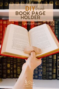 someone holding an open book in front of bookshelves with text overlay reading diy things book page holder