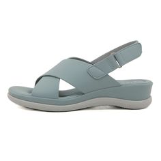 Step into comfort and style with the Siketu Norina Cushioned Slingback Sandal. These sandals feature a cushioned footbed and adjustable slingback strap for a perfect fit. The chic dusty blue color adds a touch of sophistication to any outfit. Elevate your summer footwear game with Siketu. 1.57'' heel Hook & loop velcro closure PU upper Synthetic Arch support footbed™ Cushioned Insole™ Anti-skid rubber sole Comfortable Vacation Slingback Sandals With Adjustable Straps, Comfortable Slingback Sandals With Adjustable Strap For Spring, Adjustable Blue Open Toe Slingback Sandals, Spring Comfortable Slingback Sandals, Spring Slingback Sandals With Arch Support, Blue Sport Sandals With Adjustable Strap For Summer, Blue Sandals With Adjustable Straps For Summer, Blue Leather Sandals With Arch Support, Casual Wedge Sandals With Adjustable Slingback Straps