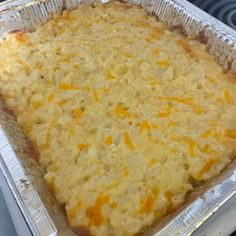 a casserole dish with cheese on top in a baking pan, ready to be baked