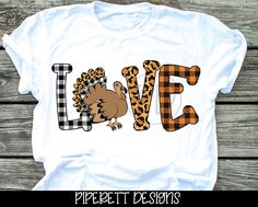 a t - shirt that says love with a turkey and leopard print on the front