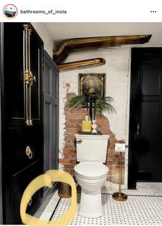 a white toilet sitting in a bathroom next to a black door