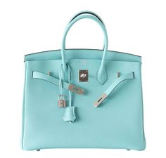 Bag: Hermès Birkin Bag Size: 35cmColor: Blue AtollMaterial: Togo Leather Hardware: PalladiumMeasures: 35x28x18cm (14"x11"x7")Condition: Pristine Includes: Lock, Keys, Clochette, Sleeper, Raincoat, Hermès Box This store-fresh Hermès Birkin 35cm bag includes all of the original accessories and has never been carried. This bag is made from togo leather, which has a very soft feel and is extremely resistant to scratching. This bag is featured in the Blue Atoll color, which is a light blue tone. This Birkin bag is accentuated by palladium hardware. Delivery 5-8 or 10-15 working days Please note that during high season and Sale period, delivery times may be affected We accept payment with a Credit card, Debit card, or PayPal. Birkin Bags, Hermes Birkin 35, Hermes Box, Togo Leather, Blue Tone, Leather Hardware, Tiffany Blue, Fashion Girl, Blue Tones