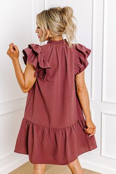 - This darling dress is the stylish option you need to add to your cart! - Fully lined material - A v-cut neckline with a front tie feature with accent beads and ruffle detail - Flutter sleeves - Hidden side pockets - A flowy yet flattering silhouette that ends in a mid-thigh length hemline Darling Dress, V Cut, V Cuts, Flutter Sleeves, Flutter Sleeve, Windsor, Shift Dress, Wine, Luxury Fashion