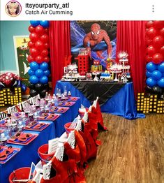 a spiderman themed birthday party with red, white and blue table cloths on the tables