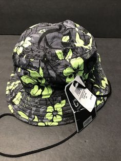 Champs Sports Gear Bucket Hat Floral Print One Size. Green Sports Bucket Hat, Green Bucket Hat For Sports, Green Breathable Hat For The Beach, Multicolor Casual Sports Hats, Black Bucket Hat For Sports, Sporty Black Bucket Hat For Sports, Multicolor Sports Hats For Spring, Casual Sports Sun Hat With Breathable Fabric, Casual Breathable Sun Hat For Sports