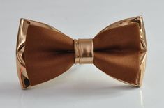 Welcome to OsunWorld! Item: Tan Brown Cotton  +  Rose Gold Faux Leather Bow tie for all ages Condition: Brand New Color:  Tan and Rose Gold  Bow tie Fits 0-12 months:width 4.5cm*Length 8cm /1.77*3.15INCH【Adjustable strap】 Bow tie Fits 1-6 Years Old: width 5cm*Length 9cm/1.97*3.50INCH 【Adjustable strap】 Bow Tie Fits 7-14 Years Old width 5.5cm* Length 10.5CM /2.17*4.13INCH【Adjustable strap】 Bow Tie Fits ADULT 6.5CM*LENGTH12CM/2.56*4.72INCH【Adjustable strap】 Adjustable Strap, one size fits most. Material: First Layer-Cotton Second Layer-Shining Faux Leather Package:1  Bow Tie Due to the use of flash photography and monitor difference, there may be slight or no color variation of item described   Payment Payments options: ETSY PAYMENT   Shipping  We are located in Perth, Australia.  Regular Po Brown Bow Tie For Party, Brown Bow Suit And Tie Accessories For Party, Adjustable Brown Bow Tie For Party, Brown Satin Bow Tie For Party, Brown Dapper Bow Tie For Party, Dapper Brown Bow Tie For Party, Classic Brown Ties For Party, Father's Day Brown Formal Bow Tie, Bow Tie Outfits Men