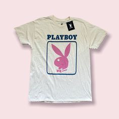 Playboy December 1963 Cover T-Shirt -Unisex Graphic T-Shirt -Size Large -Brand New With Tags, No Defects -Authentic Top -Leave A Comment If You Have Any Questions -Open To Reasonable Offers! Vintage Pink T-shirt With Graphic Design, Unisex Pink Screen Print T-shirt, Retro Pink T-shirt For Streetwear, 90s Pink Logo Print Tops, Unisex Pink T-shirt For Spring, 90s Pink Tops With Logo Print, Pink 90s Logo Print Tops, 90s Style Pink Tops With Logo Print, Pink T-shirt For Spring