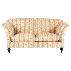 an old fashioned couch with striped fabric on the back and armrests, sitting in front of a white background