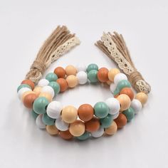 the multicolored beaded bracelet has tassels