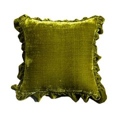 a green velvet pillow with ruffled edges