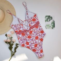 Sparkling rose all day in pretty Rosa One Piece Swimsuit. Feminine one piece swimwear features colorful flower print stretch fabric. This classic cut floral bathing suit offers the perfect amount of bottom coverage. Swim or lounge because you can enjoy it in and out of the water. Congratulations, you are one of the first to try our new swim collection! Details: Classic cut Rosa One Piece Swimsuit Bust is padded and wire free This style runs small, we recommend sizing up one full size from your t Summer One-piece For Sunbathing, Beachy Swimwear With Floral Print And Stretch, Beachy Stretch Swimwear With Floral Print, Summer Printed Swimwear For Poolside, Floral Print Stretch Tankini For Sunbathing, Stretch Floral Print Tankini For Sunbathing, Tropical One-piece Swimwear For Spring, Summer One-piece Lined Swimwear, Printed One-piece Swimsuit For Beach Season