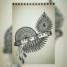 a drawing of a feather with a pen in it's mouth and an intricate design on the side