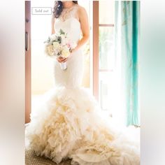 a woman in a wedding dress holding a bouquet