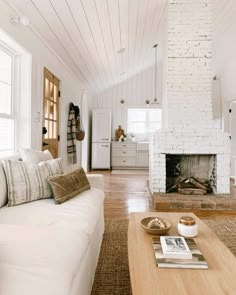 a living room filled with furniture and a fire place