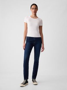 Fit: A slim, ankle-length classic.  More room than our True Skinny, but just as comfortable.  Fabric: 86% Cotton, 13% Recycled Materials, 1% Stretch.  Stretch: Stretch Jeans.  A bit of hug & a lot of hold.  Comfortable & designed to flatter. ​ Rise: High Rise Jeans.  Look: A classic five-pocket jean in a dark wash.  Details: Zip fly, five-pocket styling & holds-you-in front pockets.  Responsibly Made: This pair of jeans is part of our water-saving Washwell program.  Compared to conventional wash methods, Washwell has saved millions of liters of water since 2016.  Our High Rise Jean has an 11" 28 cm) rise.  Fitted through the hip & thigh.  Slim leg.  Ankle-length jean.  13. 25" 34 cm) leg opening. ​ Inseam: Petite 25" 63. 5 cm), Short 26" 66 cm), Regular 27. 5" 70 cm), Long 29. 5" 75 cm), T Jeans Look, Ankle Length Jeans, Water Saving, Pocket Jeans, High Rise Jeans, Slim Jeans, The Gap, Slim Legs, Petite Size