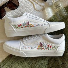 Fresh Vans Classic Old Skool trainers delicately hand embroidered with colourful windflowers in your chosen colour scheme and finished with a name, date, initials or words of your choice.  Each pair is hand made to order and stitched with high quality embroidery thread which is washable and fade resistant.  If you're looking for something a little more bespoke, I offer a limited number of fully custom hand embroidered trainers tailored to your wishes. Consider your wedding theme, your favourite flowers, your bouquet and more all tailored to your budget. We can work together to create something perfect for you. Check out my Etsy store for the 'custom order' listing, please read item description before purchase. I'm on Instagram! Follow me @OliveString for extra design inspiration and sneak Casual Sneakers With Custom Embroidery For Spring, Spring Embroidered Sneakers With Logo, White Embroidered Sneakers For Summer, Multicolor Embroidered Sneakers For Summer, White Embroidered Sneakers For Spring, Spring Sneakers With Floral Embroidery, Embroidered Trainers, Vans Embroidery Slip On, Vans Embroidery