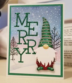 a christmas card with an image of a santa claus hat and the words merry written on it