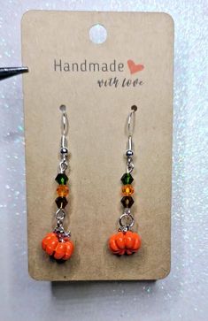 Handmade Fall Harvest Pumpkin Patch earrings with green, orange and brown crystal beads. Thanksgiving Earrings, Harvest Pumpkin, Pumpkin Earrings, Fall Harvest, Green Orange, Pumpkin Patch, Crystal Beads, Dangle Drop Earrings, Thanksgiving