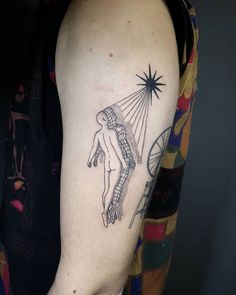 a person with a tattoo on their arm