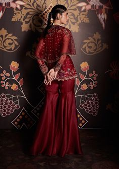 Editor's Note Embroidered Net Cape Peplum And Organza Gharara Paired With Belt Fabric: Peplum: Net, Gharara: Organza Color: Burgundy Care: Dry Clean Only  About the Designer                    ... Organza Gharara, Net Sharara, Organza Sharara, Gharara Designs, Ridhi Mehra, Raw Silk Lehenga, Anarkali Lehenga, Net Blouses, Embroidered Crop Tops