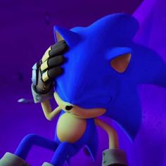 sonic the hedgehog is holding his head in one hand and looking down at something