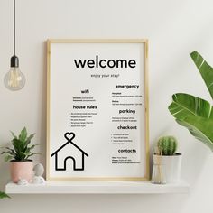 a welcome sign on a shelf next to potted plants and a lightbulb