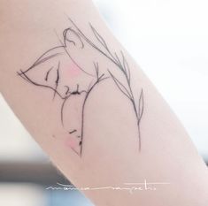 a woman's arm with a flower tattoo on the left side of her body