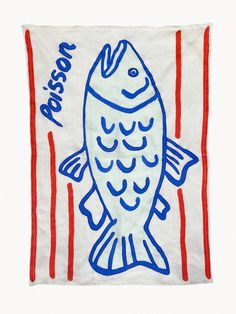 a blue and red fish is on a white towel with the words passion written across it