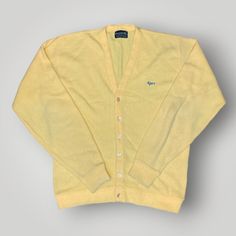 "Vintage 1970s Challenger Acrylic Cardigan Sweater Yellow Turtle This garment is in excellent vintage condition, free from flaws such as rips, tears, stains and odors. There will be light wear consistent with the age of the garment. All measurements taken lying flat across the front of the garment. Please compare to a similar garment you own to ensure fit. Pit to Pit:23\" Hem:19\" Length from Shoulder:26.5\" Sleeve from mid back:38\"" Vintage Crew Neck Cotton Cardigan, Retro Cotton V-neck Outerwear, Vintage Crew Neck Outerwear For Spring, Vintage Yellow Cotton Sweater, Vintage Cotton V-neck Outerwear, Vintage Cotton Winter Cardigan, Vintage Cotton Cardigan For Winter, Vintage Cotton V-neck Sweater, Vintage Yellow Cotton Outerwear