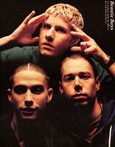 three young men are posing for the camera with their hands on their head and one is covering his ears