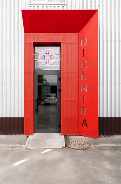 a red door with the word pizza written on it