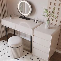 a white dressing table with mirror and stool