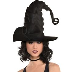 a woman wearing a black witches hat