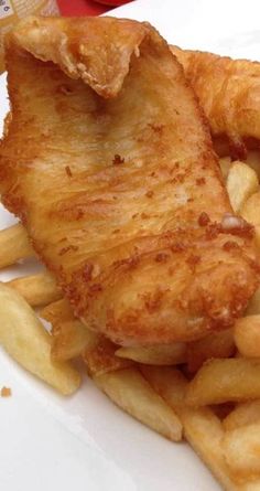 fried fish and fries on a white plate