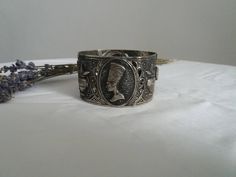 Vintage 1960s costume bracelet ,silvertone metal egyptian motifs. Measures length :8'' width: 2'' condition: excellent Shipping Is Avaliable Worldwide. Every item is carefully shipped Priority via Air Mail - shipping takes from 7 to 14 working days, depending on your location. Shipping includes Tracking. Come and check out our shop to see all items! https://www.etsy.com/shop/Themagicstories?ref=hdr_shop_menu Thanks! Note: m i n t : pristine with no signs of wear- possibly deadstock e x c e l l e Ceremonial Silver Art Deco Jewelry, Antique Silver Nickel-free Cuff Bracelet, Vintage Silver Metal Bangle, Vintage Nickel Free Silver Cuff Bracelet, Antique Silver Metal Bangle, Vintage Nickel-free Antique Silver Cuff Bracelet, Antique Metal Cuff Bracelet With Engraving, Vintage Silver Etched Cuff Bracelet, Antique Metal Engraved Cuff Bracelet