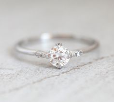 a white gold engagement ring with diamonds on it