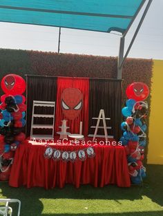 a spiderman themed birthday party with balloons