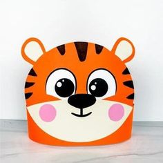 a close up of a toy box with a tiger face on it