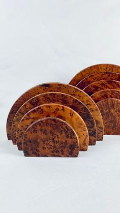 six wooden plates sitting on top of each other