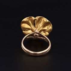 A picturesque pansy ring featuring a chocolate brown and pink bloom with hand drawn veining. The delightful flower is set with a diamond and mounted in 14k gold. It was originally an antique brooch that our jeweler transformed by removing the pin stem and adding a split 14k gold band. The face of the ring measures 0.85 inches from top to bottom by 0.8 inches wide, and it is in great condition with only one small chip to the enamel (visible under magnification). The ring is currently a size 6.5, Vintage Yellow Gold Flower Ring For Formal Occasions, Heirloom Yellow Gold Flower Ring For Formal Occasions, Vintage Formal Rings With Flower Shape, Heirloom Flower Jewelry For Formal Occasions, Gold Victorian Flower Ring For Formal Occasions, Vintage Rose Gold Flower Ring For Formal Events, Vintage Rose Gold Flower Ring For Formal Occasions, Victorian 14k Gold Flower Ring For Formal Occasions, Vintage Flower Shaped Jewelry With Rose Cut Diamonds