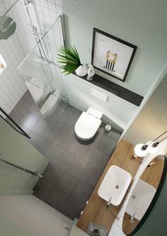 an aerial view of a bathroom with toilet, sink and shower