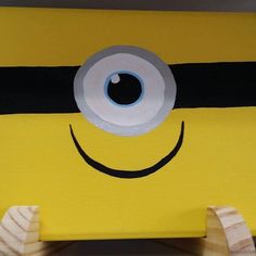 a close up of a cardboard cut out of a minion