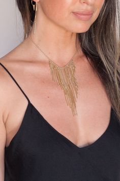 We are always about FRINGE and this necklace is so hot!!! STYLE: Wear as a statement piece; if you layer it will look too busy!! So focus on your earrings and bracelets to accent this piece instead of more jewels :) Wear alone for a simple modern chic look DETAILS: 14" Gold-filled chain and accessories with 3" extender chain The longest chain is 4" in the Yellow gold or white gold chain and accessories available upon request Gold-tone Chain Jewelry For Party, Metal Lariat Jewelry With Chain Detail, Metal Lariat Chain Jewelry, Metal Clavicle Chain Drop Necklace For Party, Modern Jewelry With Delicate Chain For Party, Metal Jewelry With Adjustable Chain For Party, Layered Dangle Necklace With Adjustable Chain For Parties, Party Jewelry With Adjustable Metal Chain, Modern Multi-strand Gold Jewelry