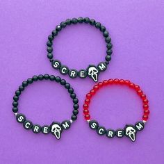 three bracelets that say scream, scream and scream