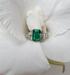 4 CT Green Emerald Cut Side Baguette Cut Multi Stone Engagement Ring 10K 14K 18K Solid White and Rose Gold Wedding Ring Anniversary Ring Bridal Ring R I N G M E T A L ✥ Metal :  925 Sterling Silver, 10K 14K 18K Solid White Yellow and Rose Gold ✥ Metal Clarity : Pure ✥ Stamp/Hallmark : Yes M A I N S T O N E S ✥ Type : Moissanite Diamond ✥ Shape : Emerald Cut ✥ Weight : 4 Ct ✥ Diamond Color : Green ✥ Clarity : VVS1 ✥ Diamond Cut : Excellence S I D E S T O N E S ✥ Type : Moissanite Diamond ✥ Shape : Baguette Cut ✥ Weight :  1.85  Ct ✥ Color : White ✥ Clarity : VVS1 ✥ Cut : Very Good R I N G S I Z E S ✥ All Ring Size are Available ✥ If You Have any Questions With Regards to Sizing Please Contact as S H I P P I N G ✥ Free Express Delivery ✥ No Extra Charge For Delivery  ✥ Fastest  Delivery Avai Wedding Baguette Cut White Gold Emerald Ring, Wedding White Gold Emerald Ring Baguette Cut, Rectangular Emerald Ring In White Gold For Wedding, Classic Emerald Ring With Baguette Diamonds For Anniversary, Art Deco Emerald Ring In Baguette Cut White Gold, Classic Emerald Ring With Baguette Diamonds For Wedding, Emerald Ring With Baguette Diamonds For Wedding, Baguette Diamond Emerald Ring For Wedding, Baguette Cut Emerald Ring With Diamonds For Wedding