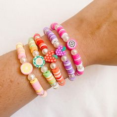 Due to the nature of the beads and variations in colors, the bracelet you receive may not be 100% identical to the one in the photo. ☁️ MATERIALS:  ☆ Durable clear elastic  ☆ Heishi beads (clay beads)  ☆ Pearl beads  ☆ Fruit clay beads ☆ All bracelets are sealed to prevent breakage  📏 SIZING: All of our bracelets are 6.5 inches wide. If you would like to customize your size, message us prior to purchasing! 🍓 CARE:  Our bracelets can get wet, however we recommend to avoid water to maintain the quality and brilliance of the bracelet. If your bracelet does get wet, gently pat dry with a towel. Store in a dry, cool place, and avoid direct sunlight to avoid any fading in the colors.  Please do not overstretch the bracelets, as they may snap if stretched too far.  📦 SHIPPING: Orders $35+ free Dragon Fruit Clay Bead Bracelet, Fruit Clay Bead Bracelets, Bracelet Clay Bead, Beads Fruit, Bracelet Boutique, Bracelet Clay, Make Clay Beads, Jewelry Booth, Beads Clay