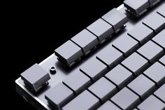 a close up view of an electronic keyboard with black and white squares on the keys