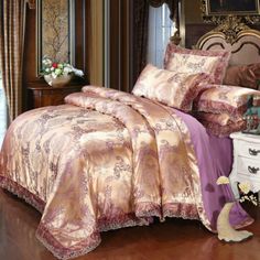 the bed is made with pink and gold comforters