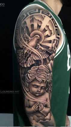 a man with a tattoo on his arm that has an angel and dove in it